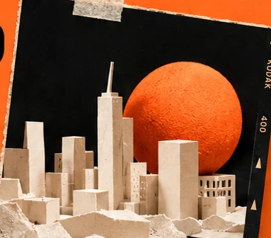 Paper city collage with orange sun